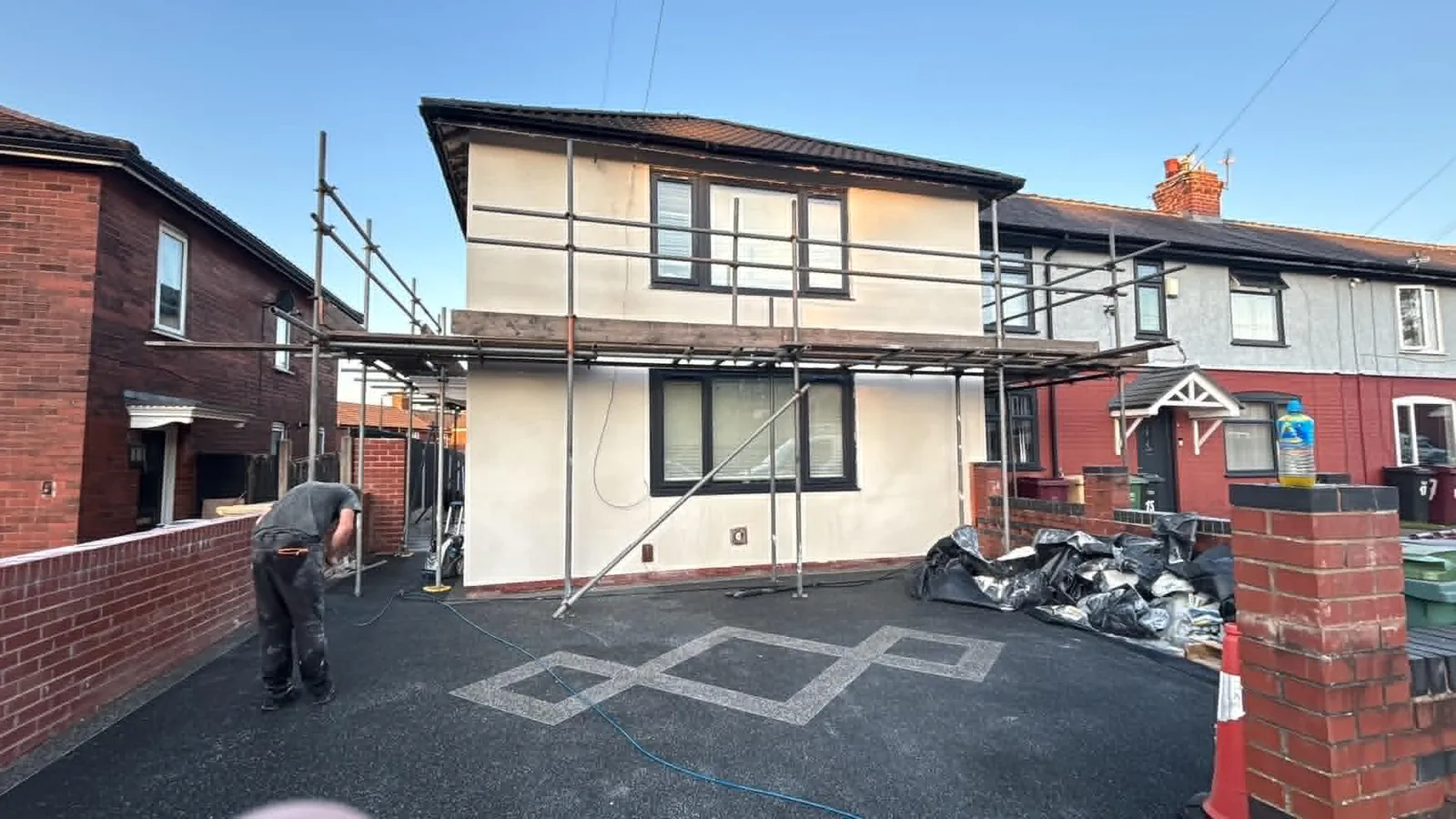 Freshly rendered detached house with scaffolding still up on the rear elevation