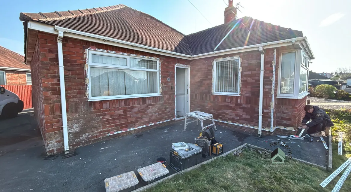 Pebble dash removal in progress on a bungalow